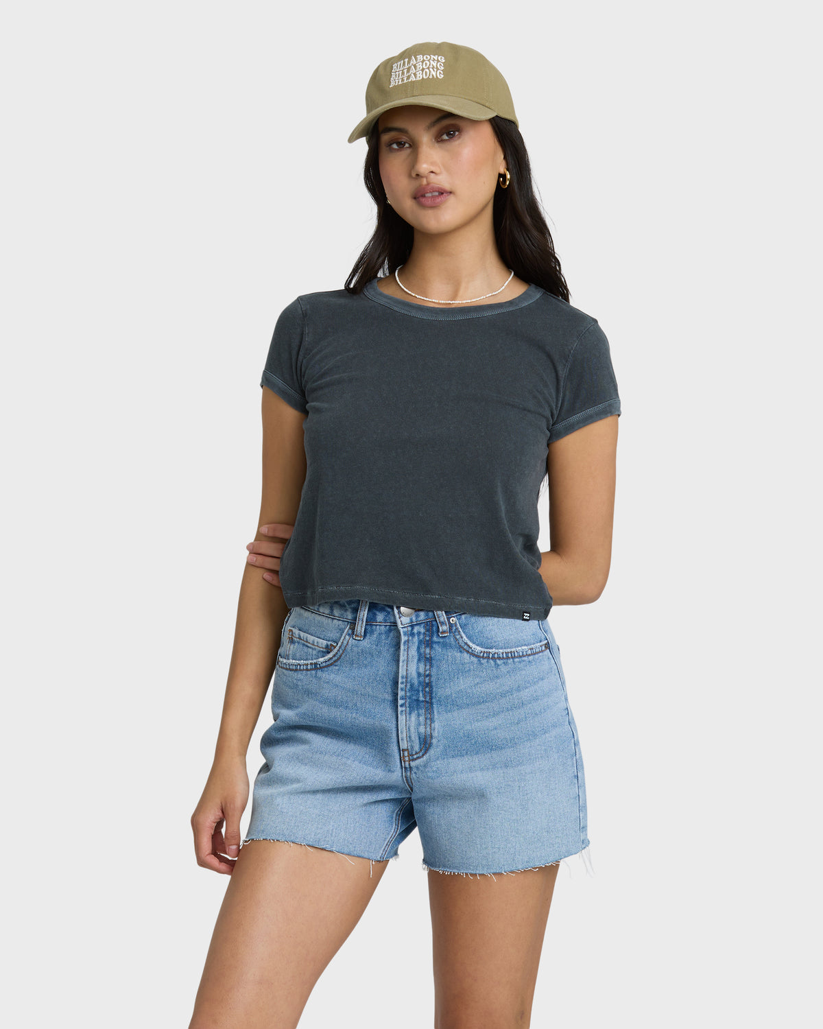 Faded indigo denim shorts with frayed cut-off hem and high-rise waist.