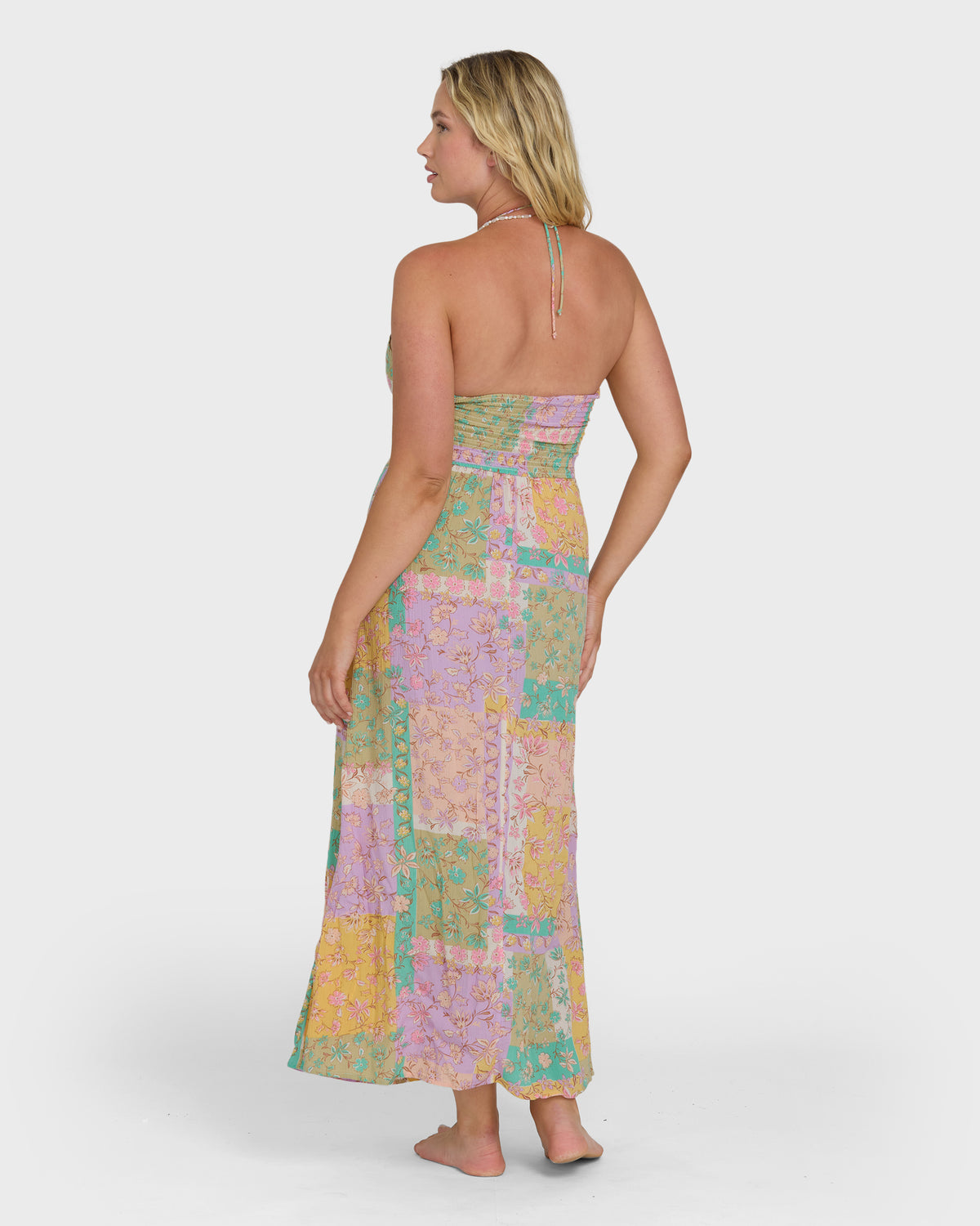 Halter maxi dress in vintage violet with multicolor patchwork floral print and ruched bodice.