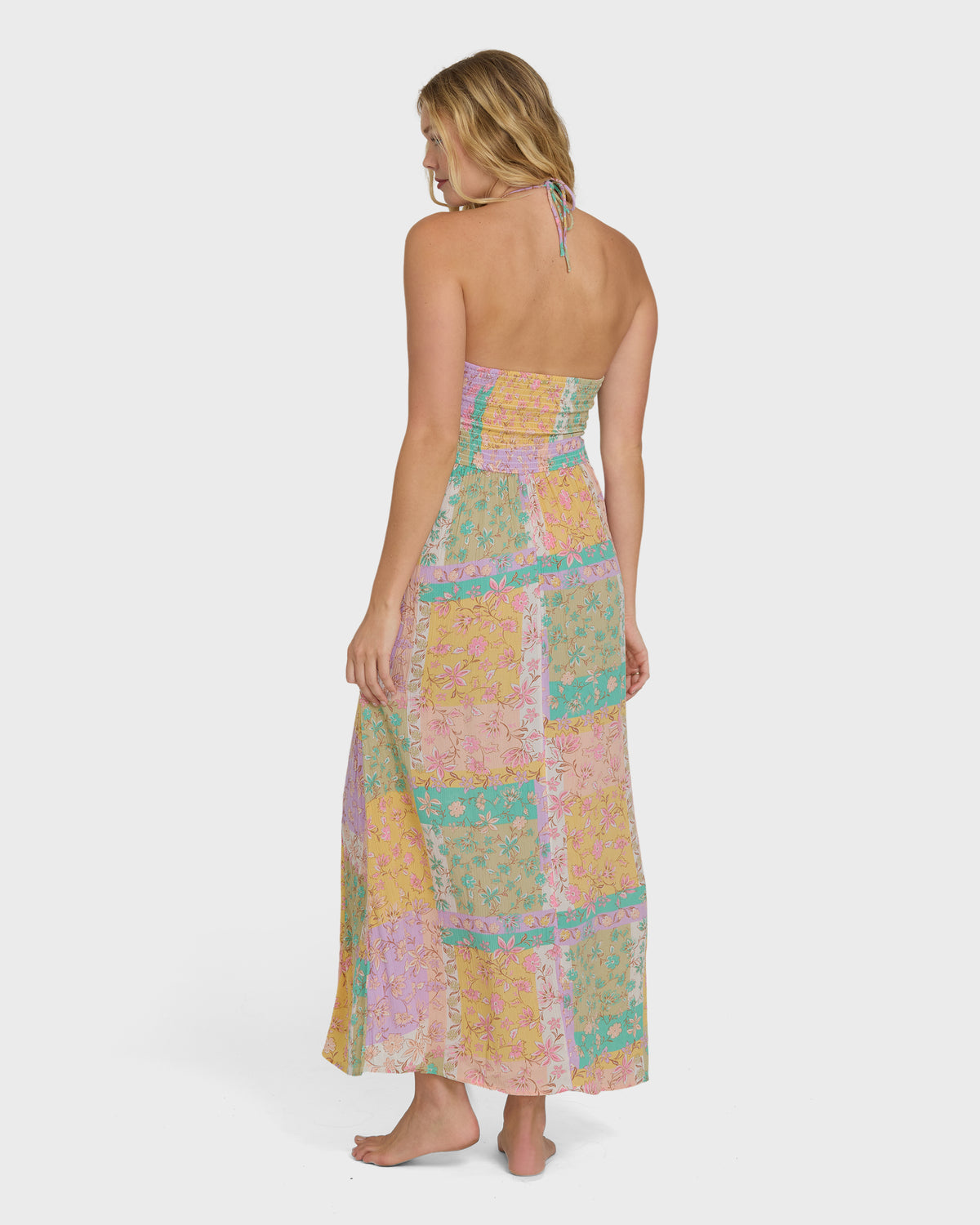 Halter maxi dress in patchwork vintage violet, yellow, green and pink with floral patterns and ruched bodice.