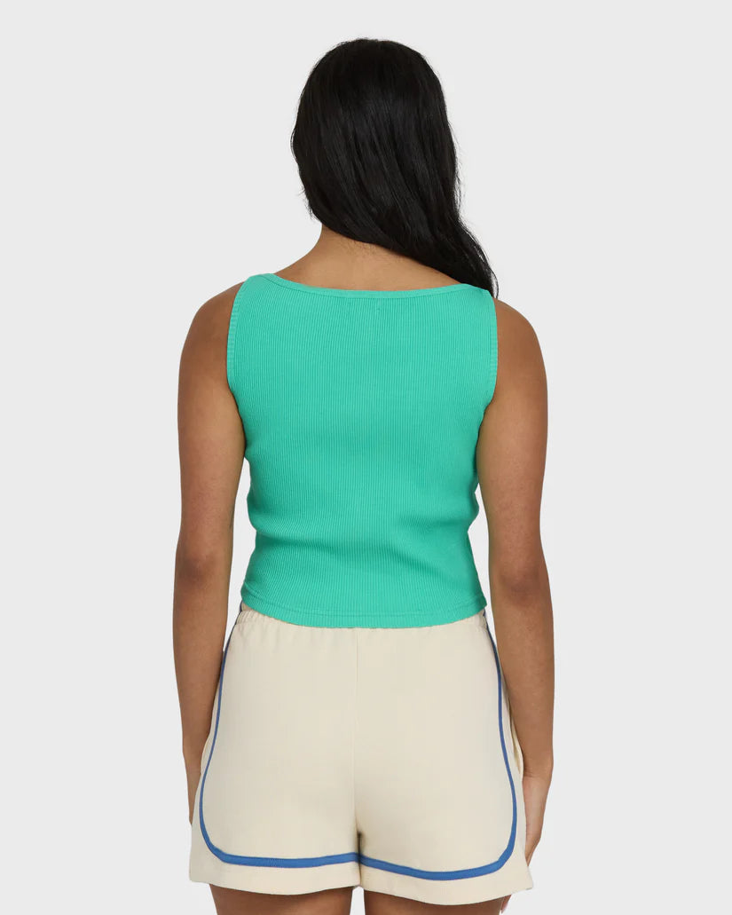 Cream fleece shorts with blue trim paired with turquoise ribbed tank top, shown from back.