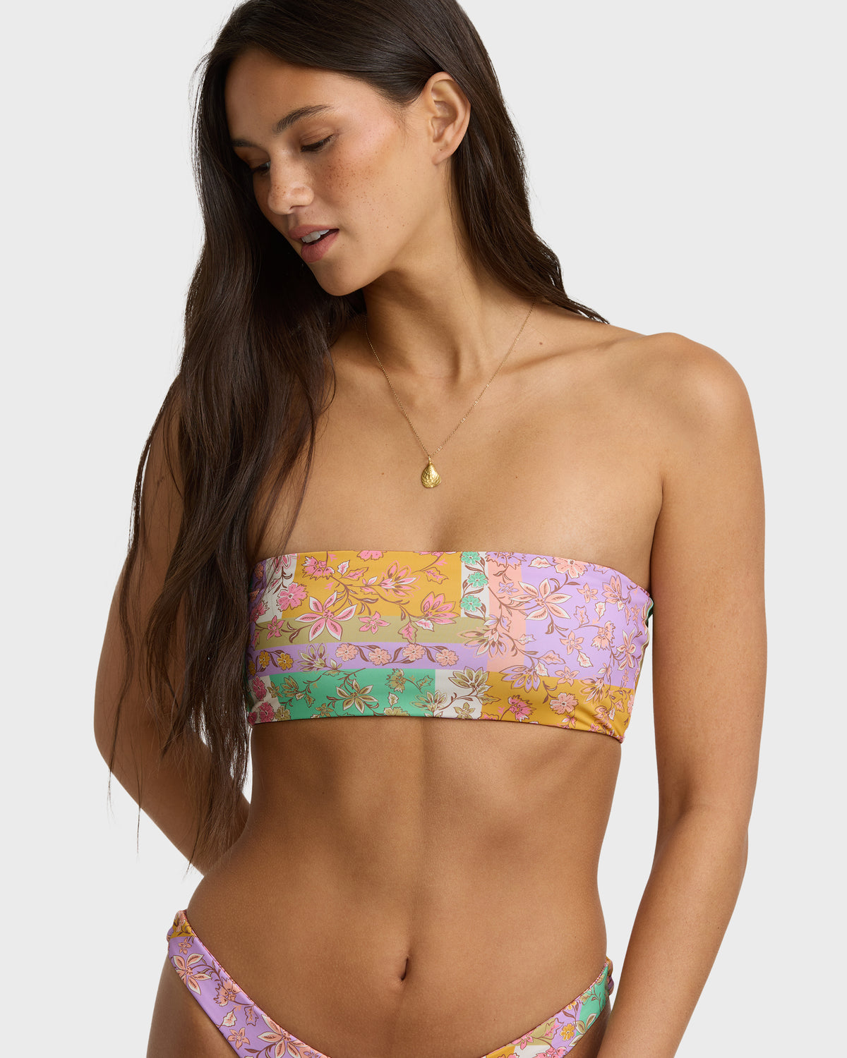Reversible bandeau bikini top with floral print in lilac, yellow, and green colorways.