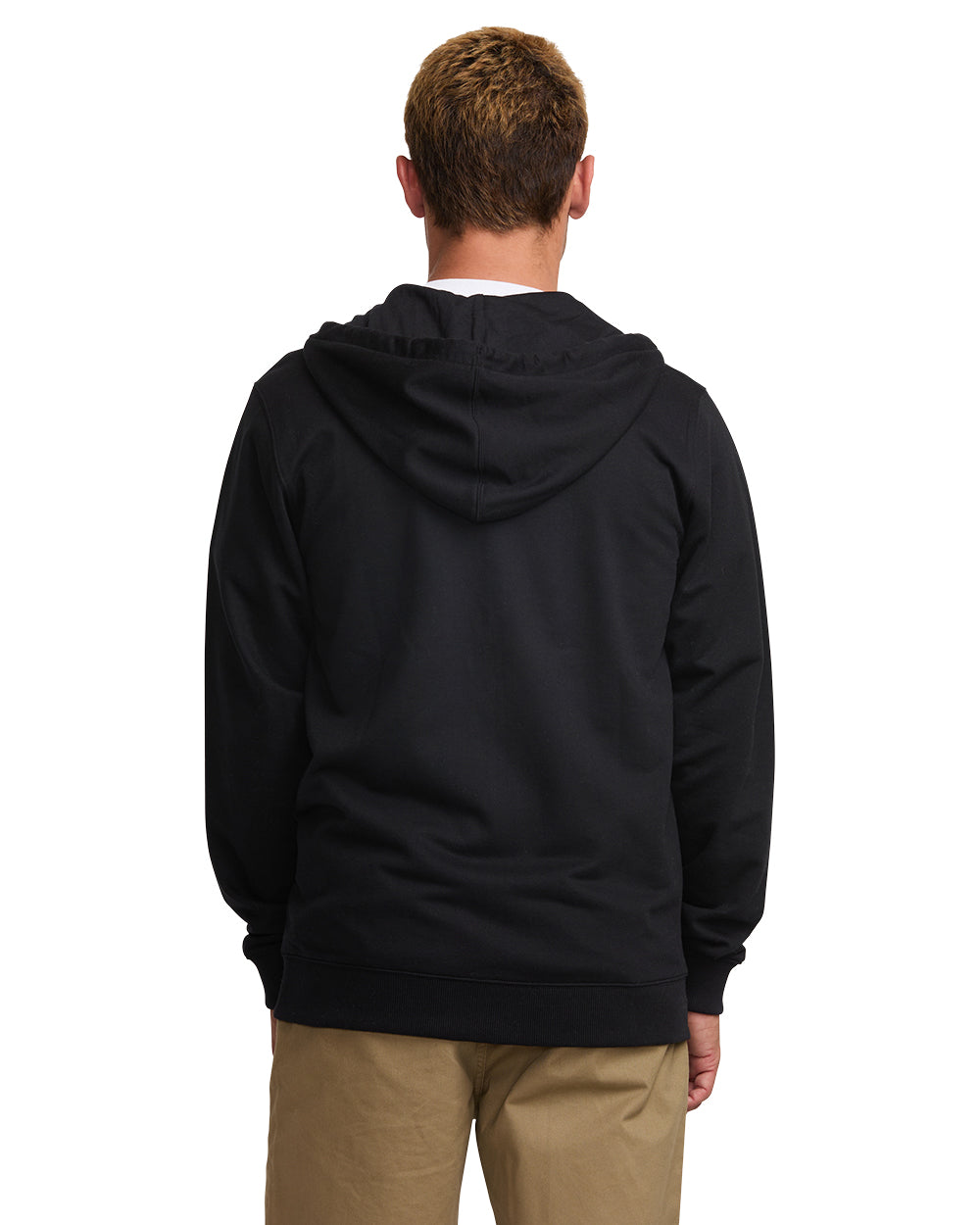 Black zip front hoodie with drawstring hood, worn over tan pants, shown from back view.