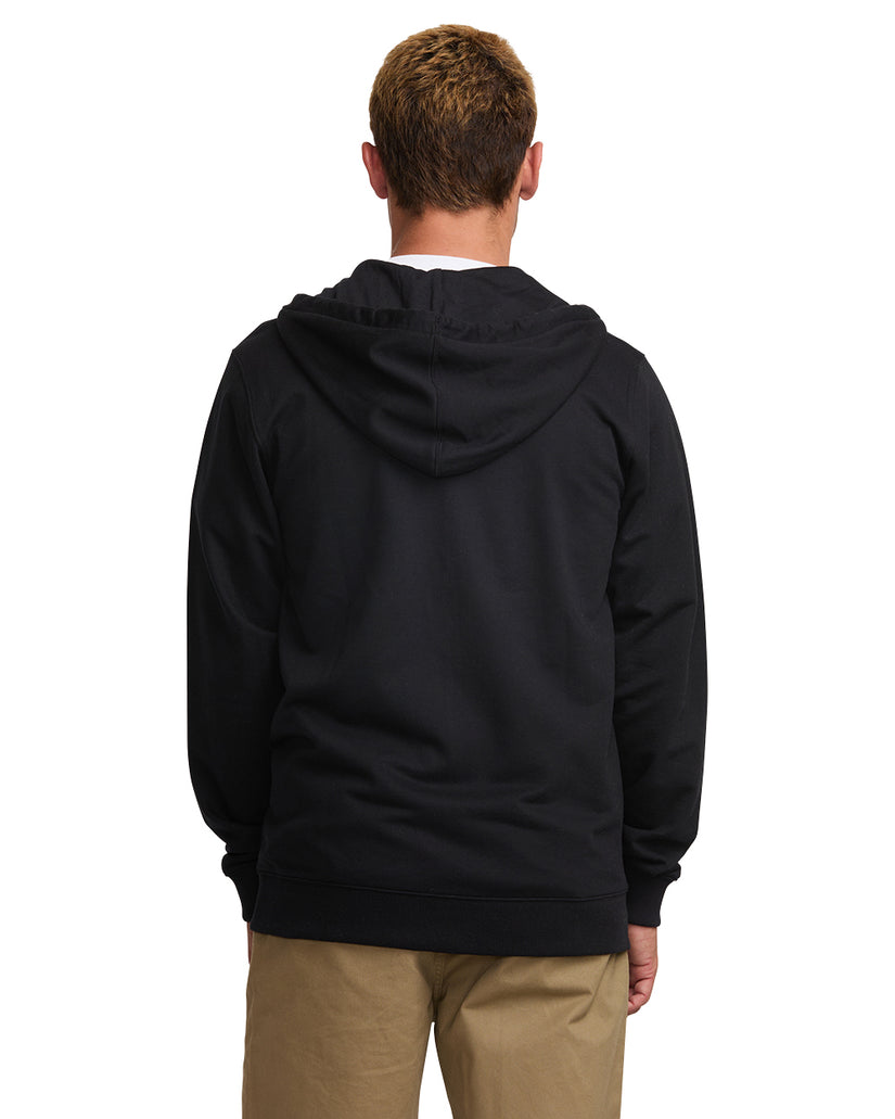 Black zip front hoodie with drawstring hood, worn over tan pants, shown from back view.