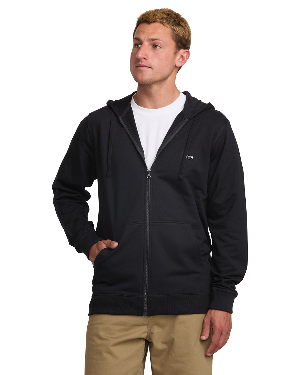 Black zip front hoodie with hood, worn over white t-shirt and tan pants.