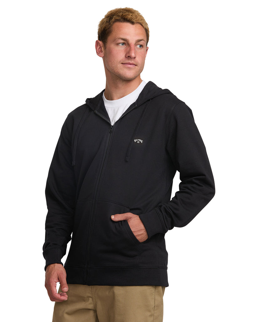 Black zip-front hoodie with drawstring hood and front pockets, worn over white t-shirt.