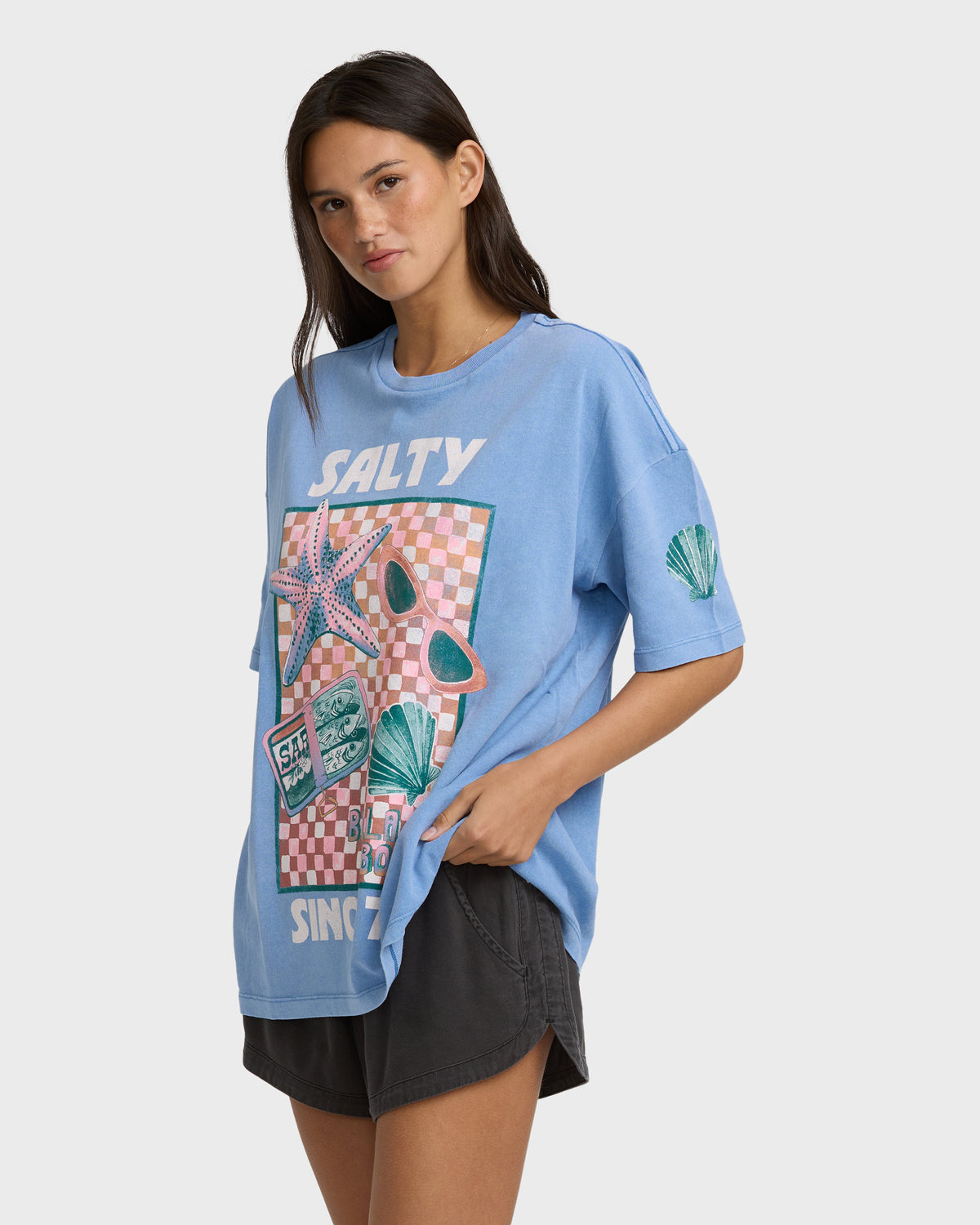 Blue short-sleeve t-shirt with "Salty" text and graphic print featuring starfish, sunglasses, and checkered pattern.