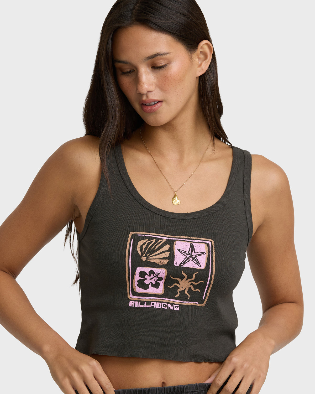 Off-black sleeveless tank top with colorful graphic print featuring shell, starfish, flower, and sun motifs with Billabong te
