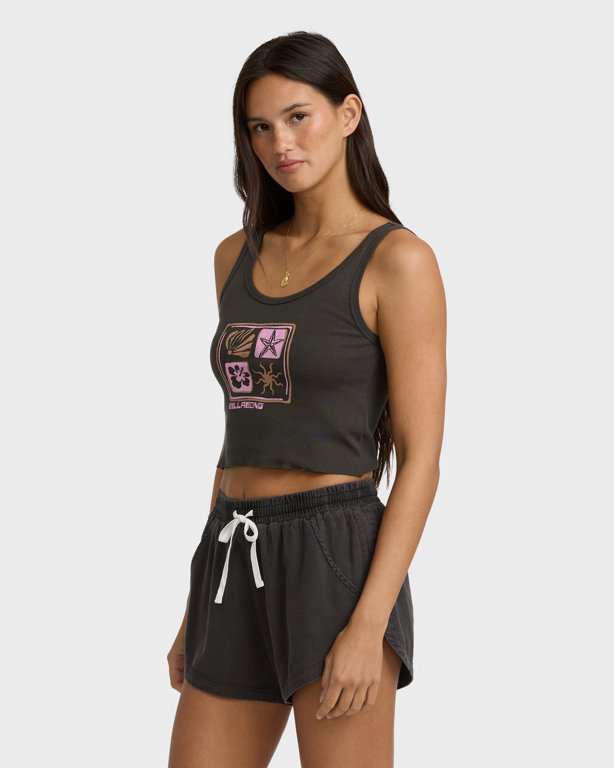 Off-black sleeveless tank top with multicolored graphic design featuring four botanical and celestial symbols in squares on t
