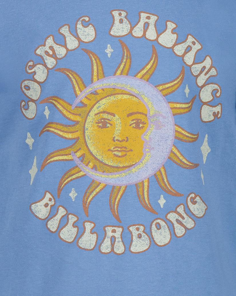Blue t-shirt with a sun and moon design and 'Billabong' branding on a blue background
