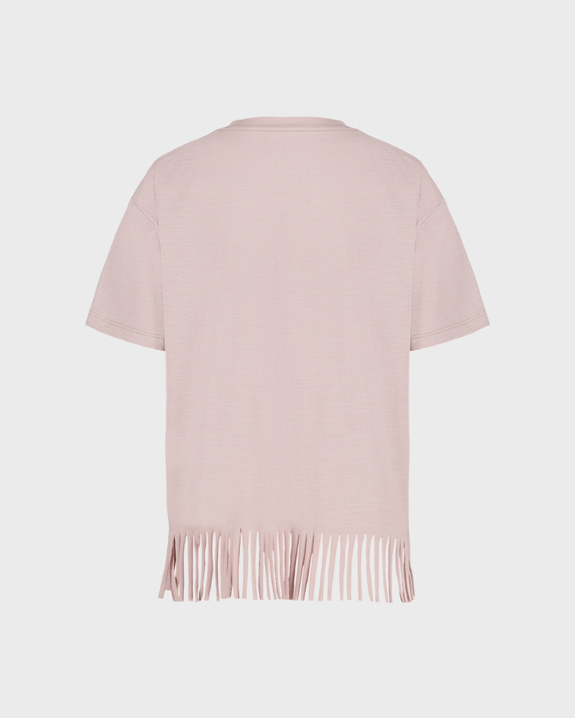 Light pink short-sleeve top with fringe details on a light gray background
