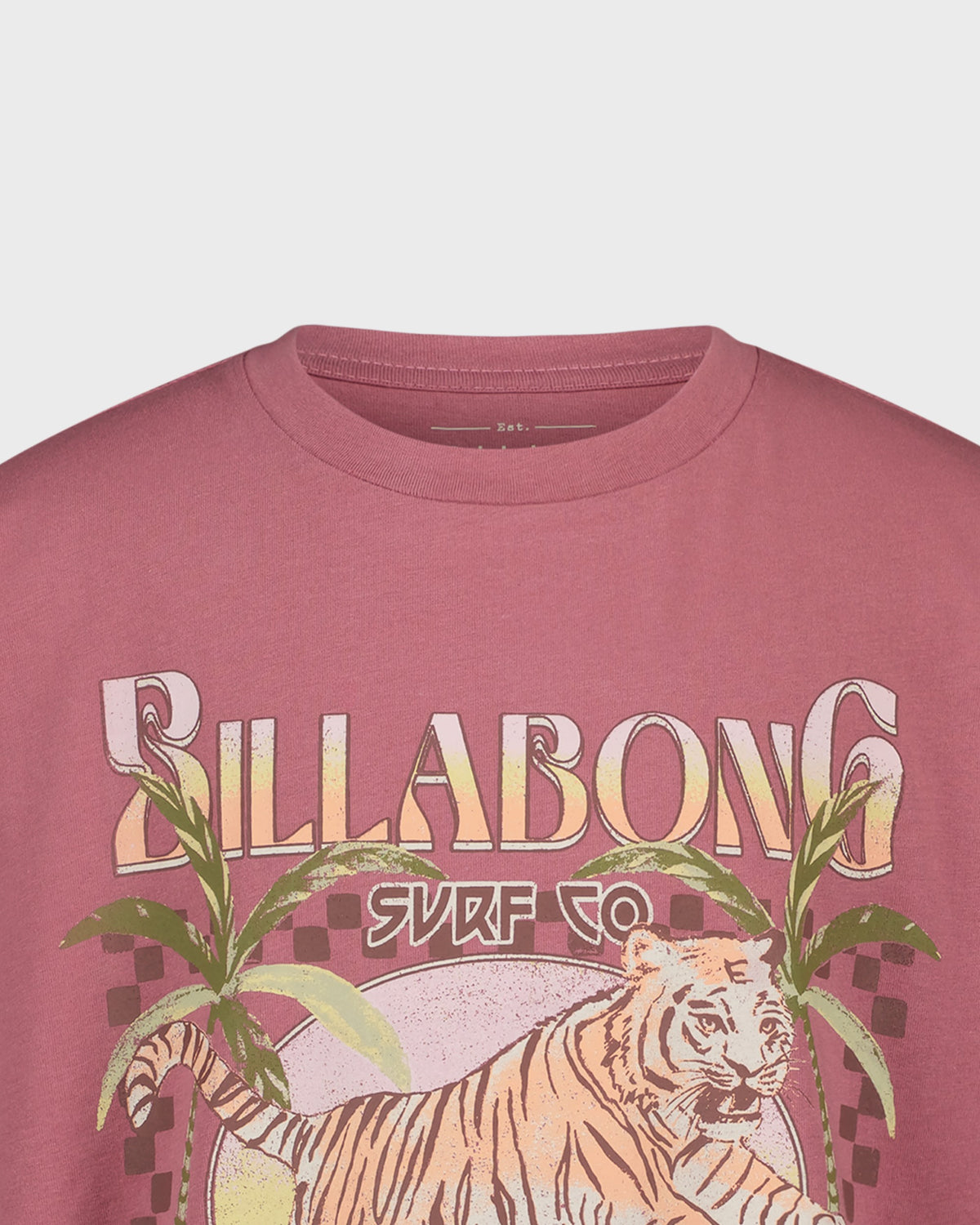 Pink t-shirt with Billabong logo and tiger design on a light gray background