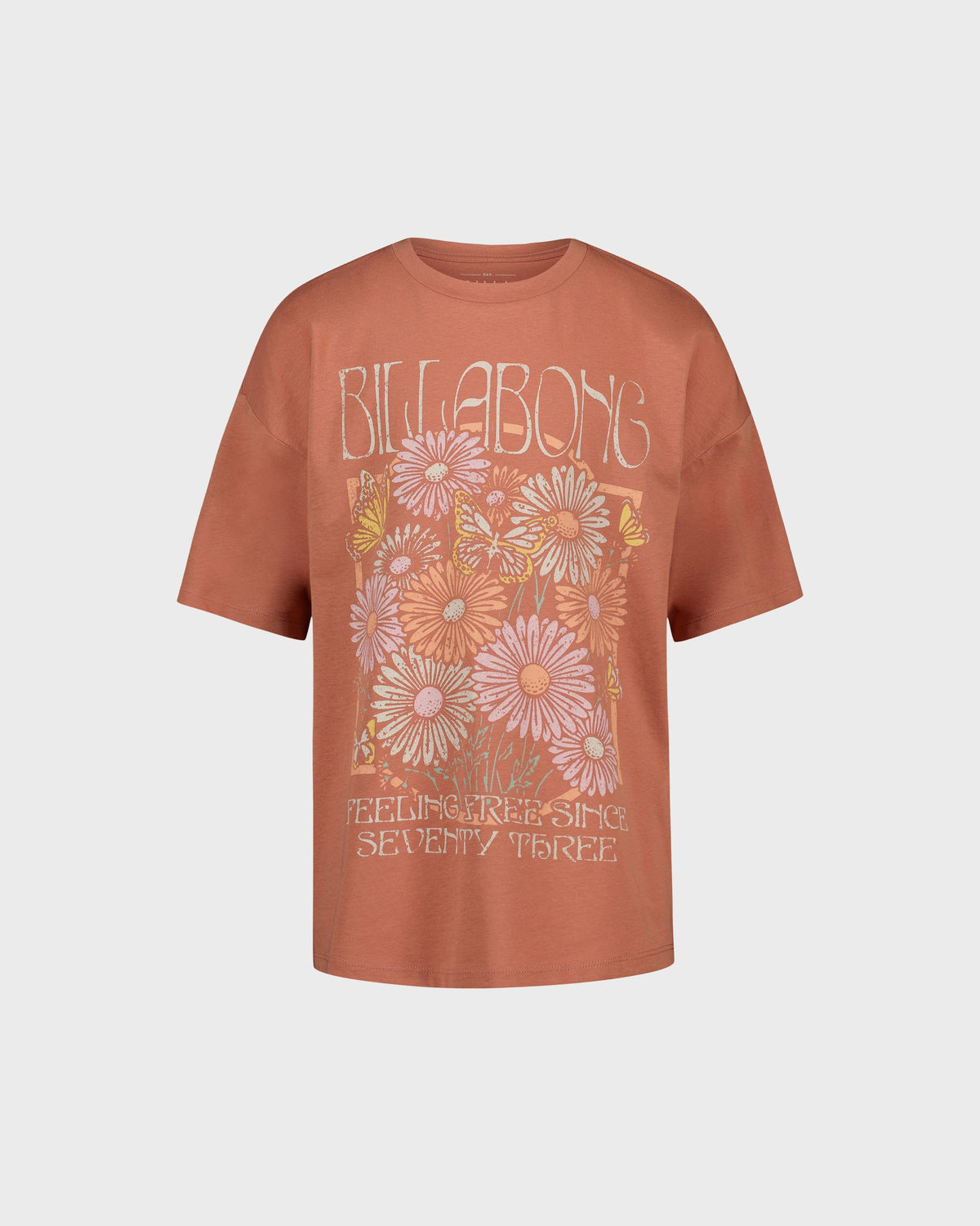 Brown t-shirt with floral design and 'Billabong' branding on a light gray background