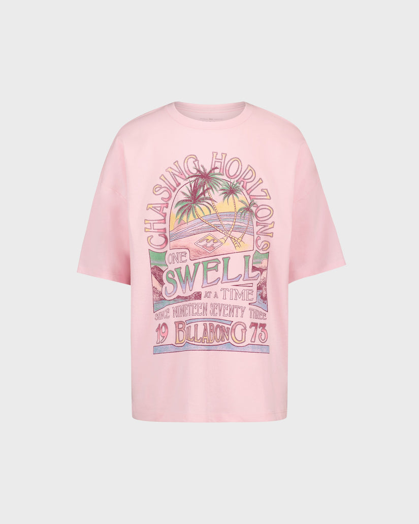 Pink t-shirt with colorful graphic design on a light gray background