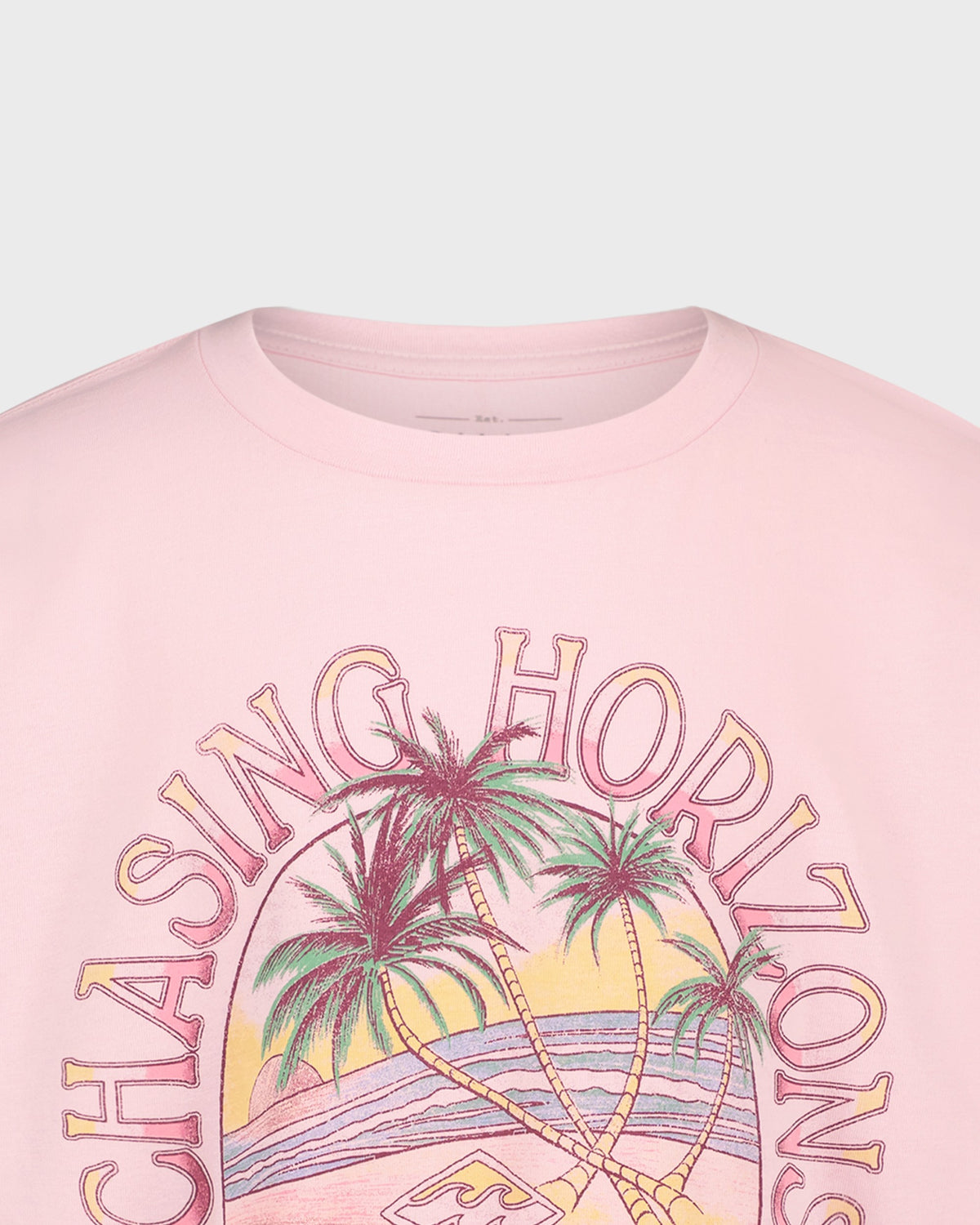Pink t-shirt with 'Chasing Horizons' graphic design featuring palm trees and a sunset.