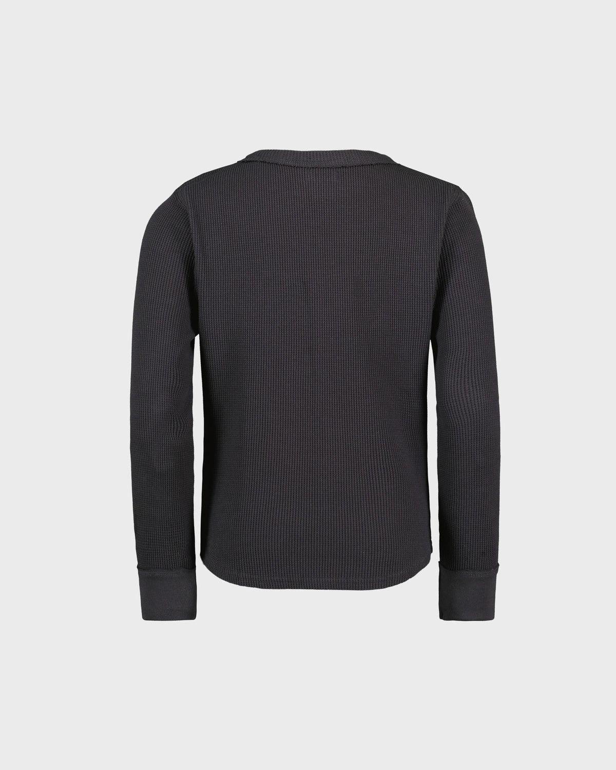 Black ribbed sweater on a light gray background