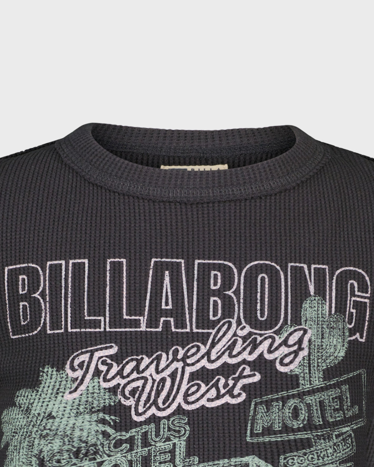 Black sweater with Billabong branding and cactus graphics on a gray background