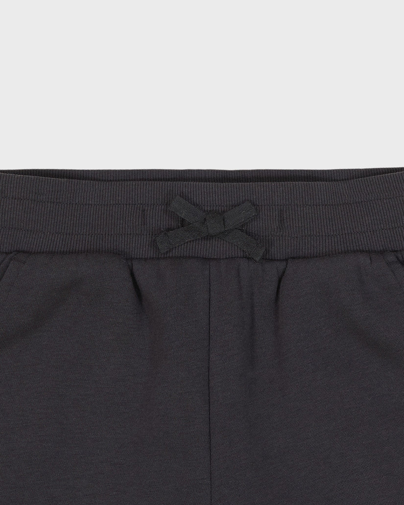 Dark gray sweatpants with a drawstring on a light gray background