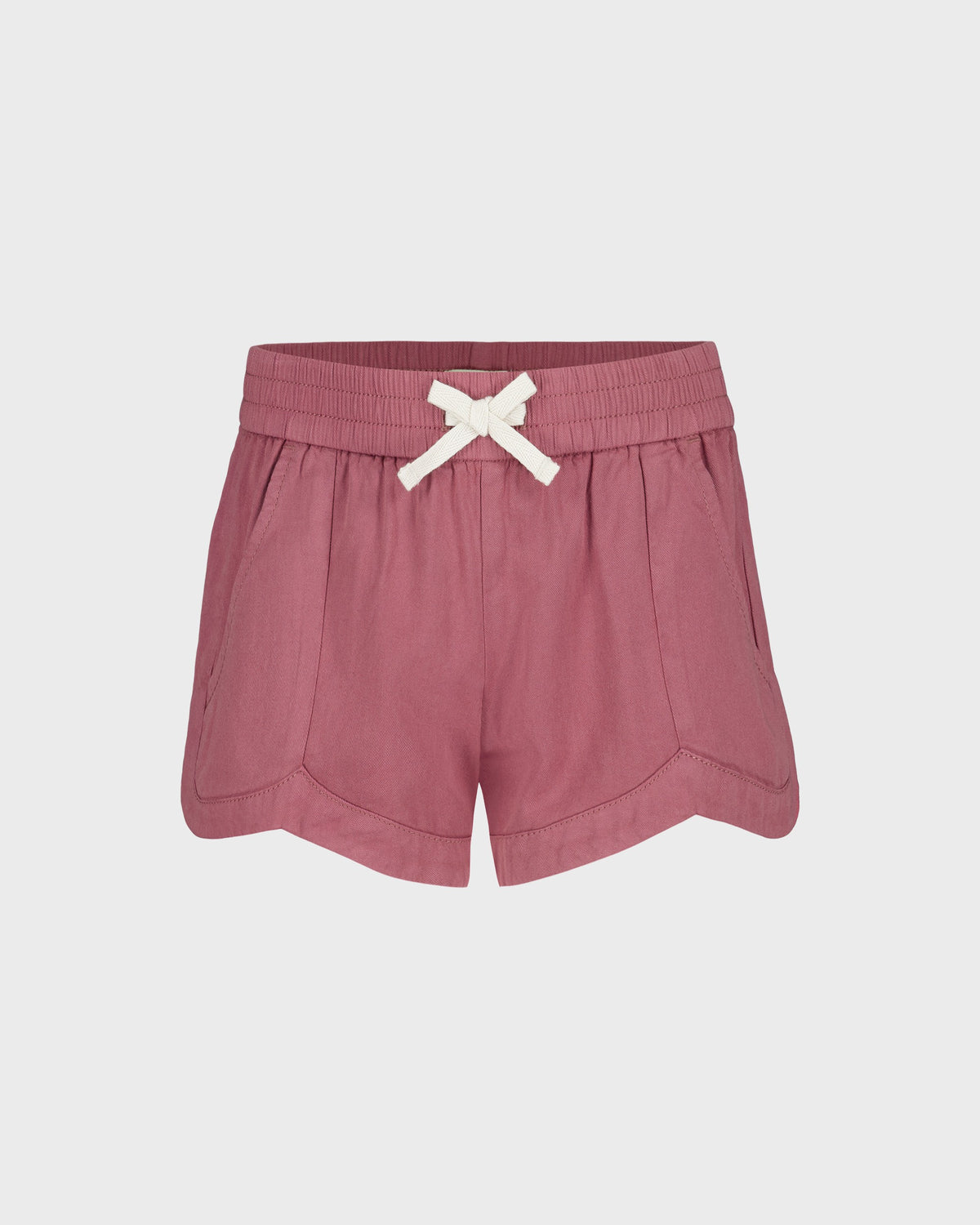 Pink shorts with a white bow on a light gray background