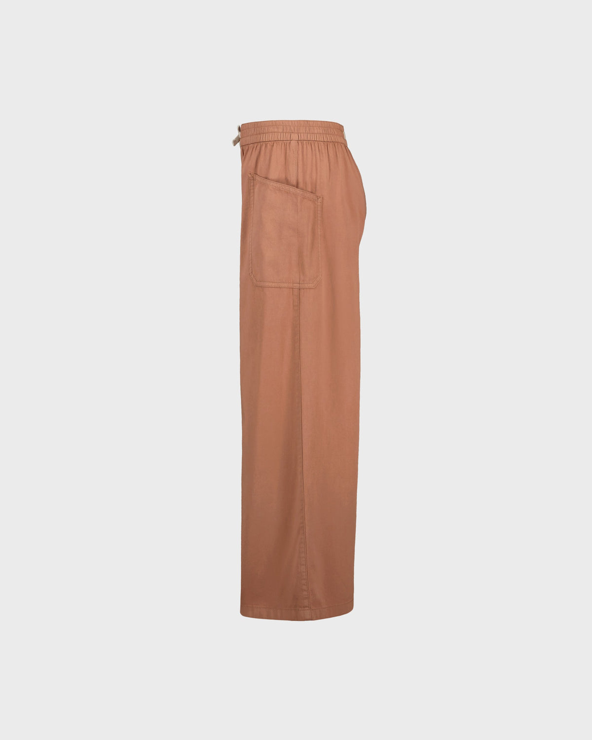 Tan pants on a light gray background