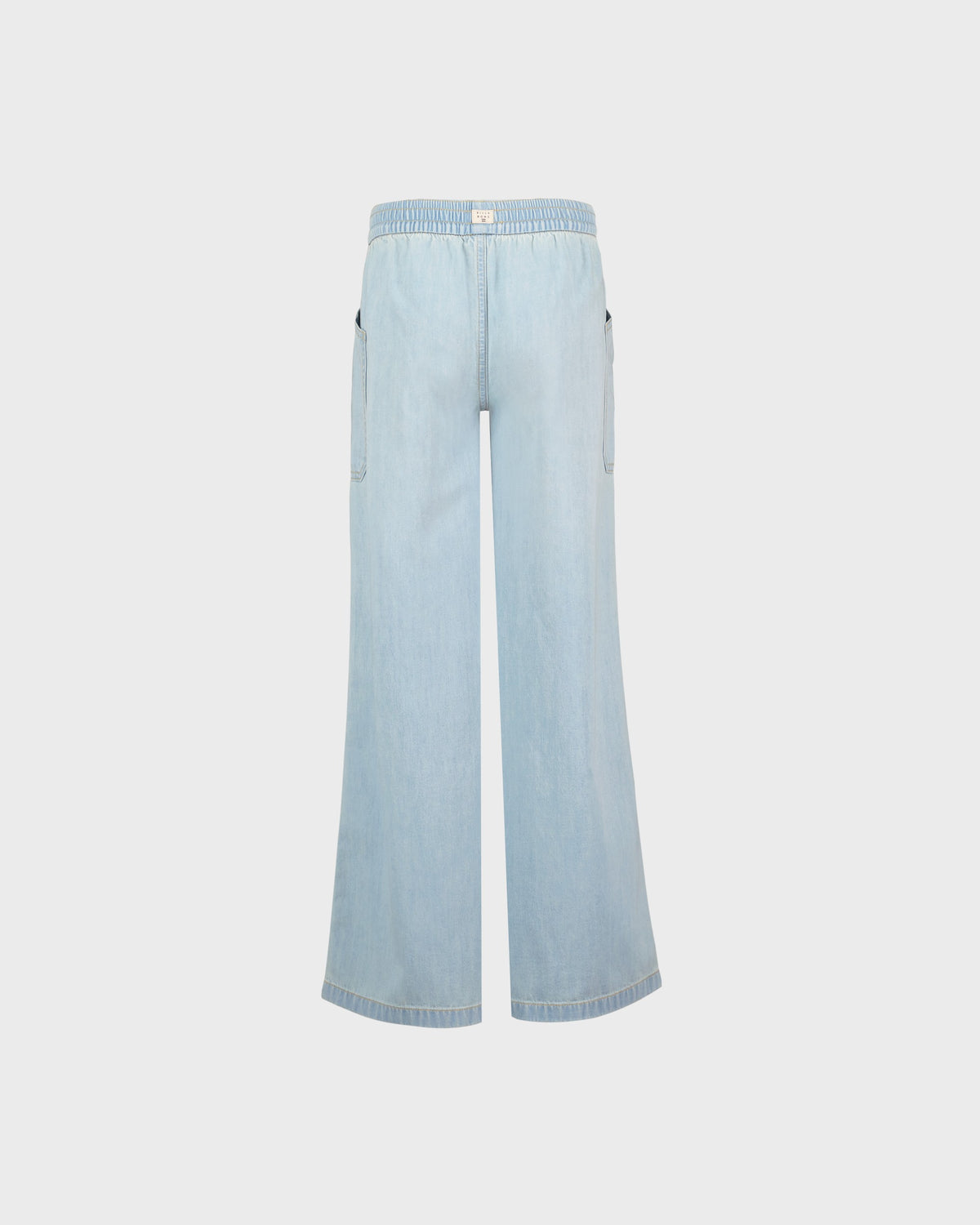 Light blue wide-leg jeans on a light gray background