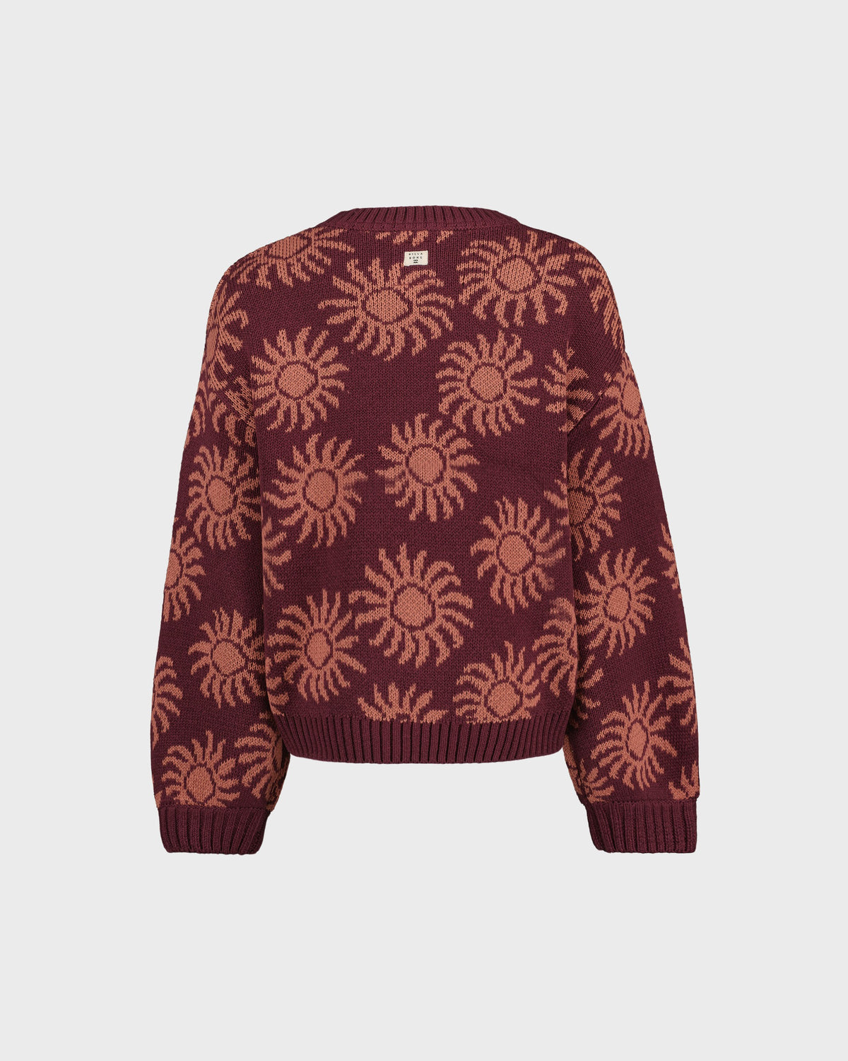 Maroon sweater with sun pattern on a light gray background