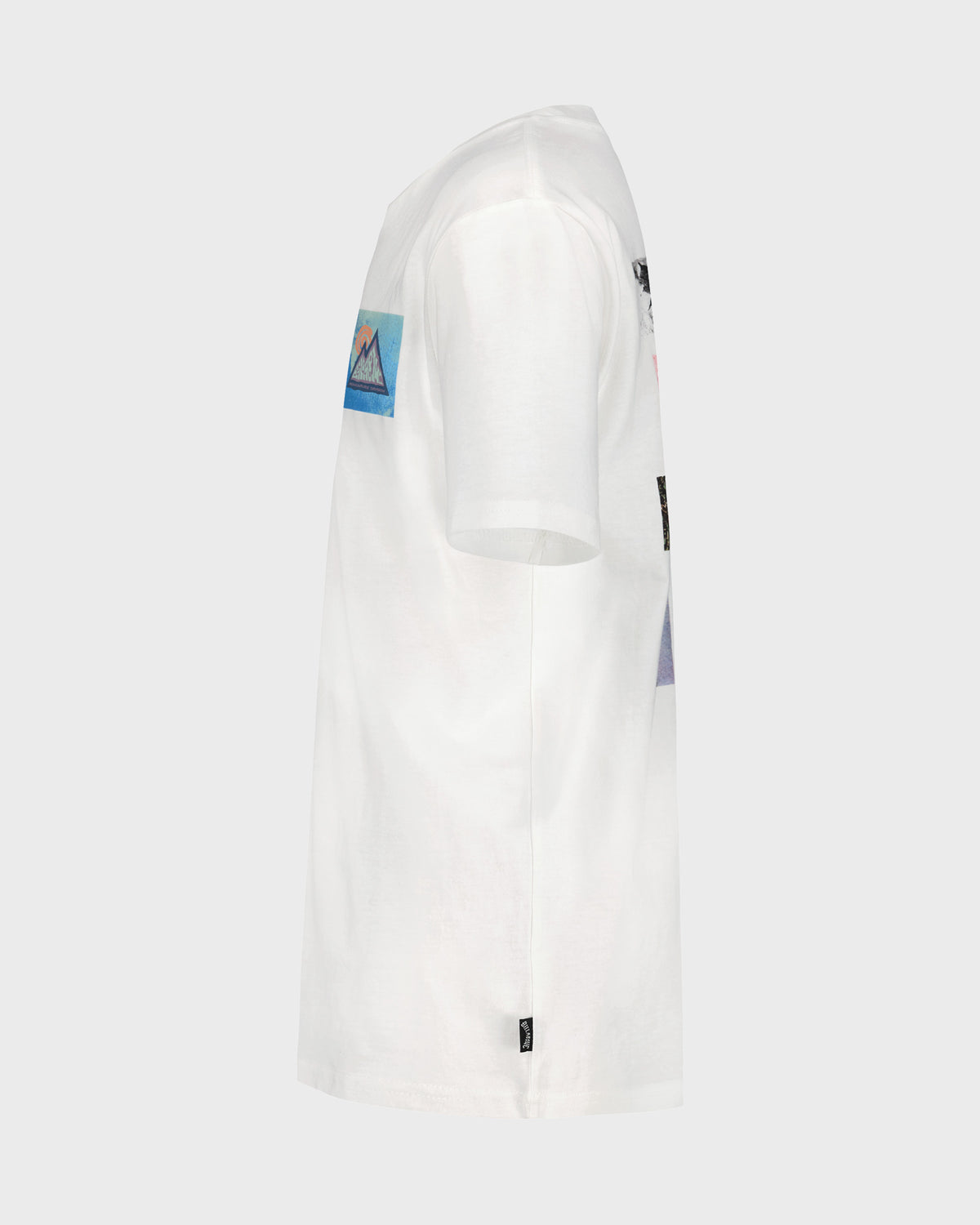 White short sleeve t-shirt with blue and black graphic patches on the chest and side.