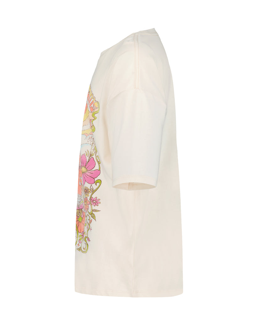 Cream oversized t-shirt with colorful floral and butterfly graphic on the sleeve.