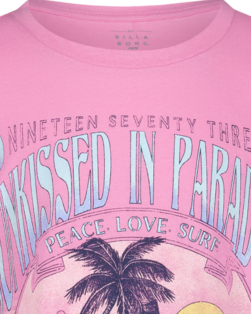 Pink t-shirt with "Nineteen Seventy Three Crossed in Paradise" text, palm tree, and sun graphic on chest.