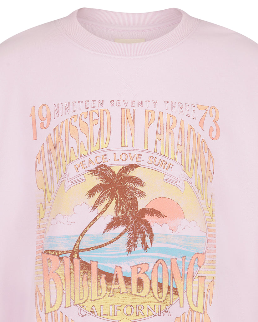 Light pink crewneck sweatshirt with graphic print featuring palm tree, sunset, and text reading "Nineteen Seventy Three" and 