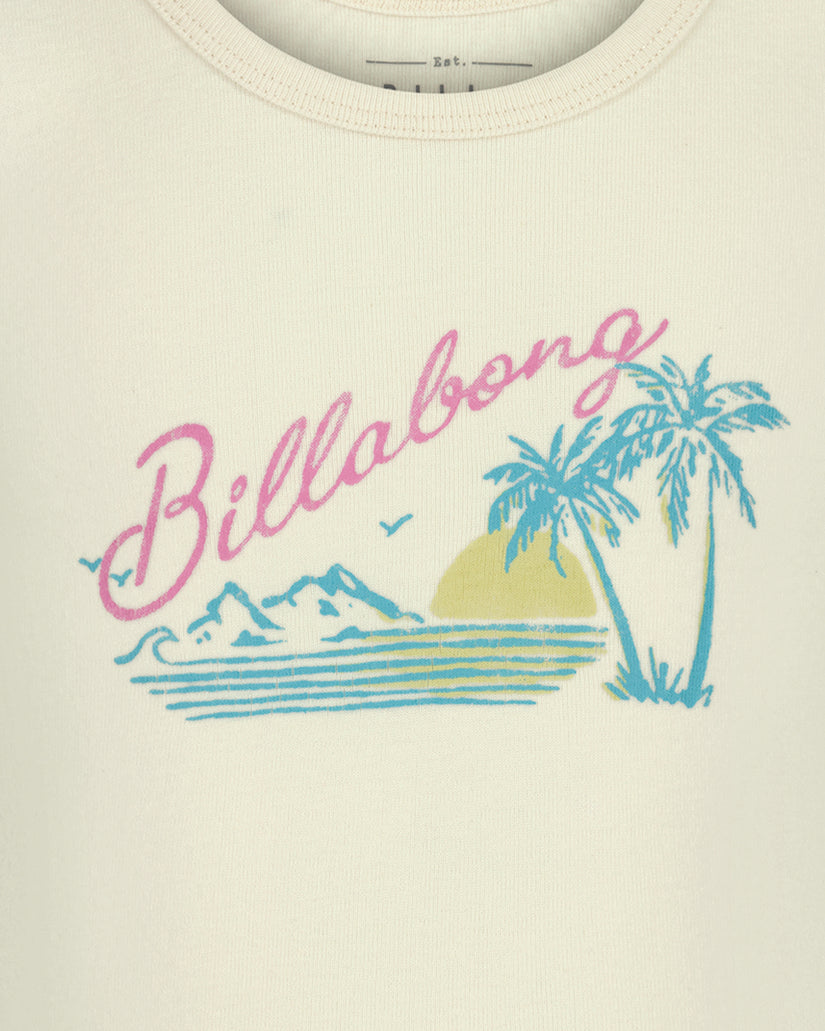 Cream tank top with pink "Billabong" text and blue graphic of palm tree, mountains, and sun.