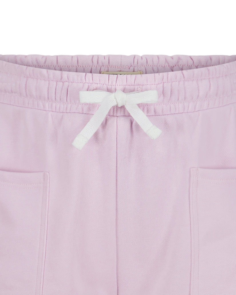 Light pink shorts with white drawstring waistband and front pockets.