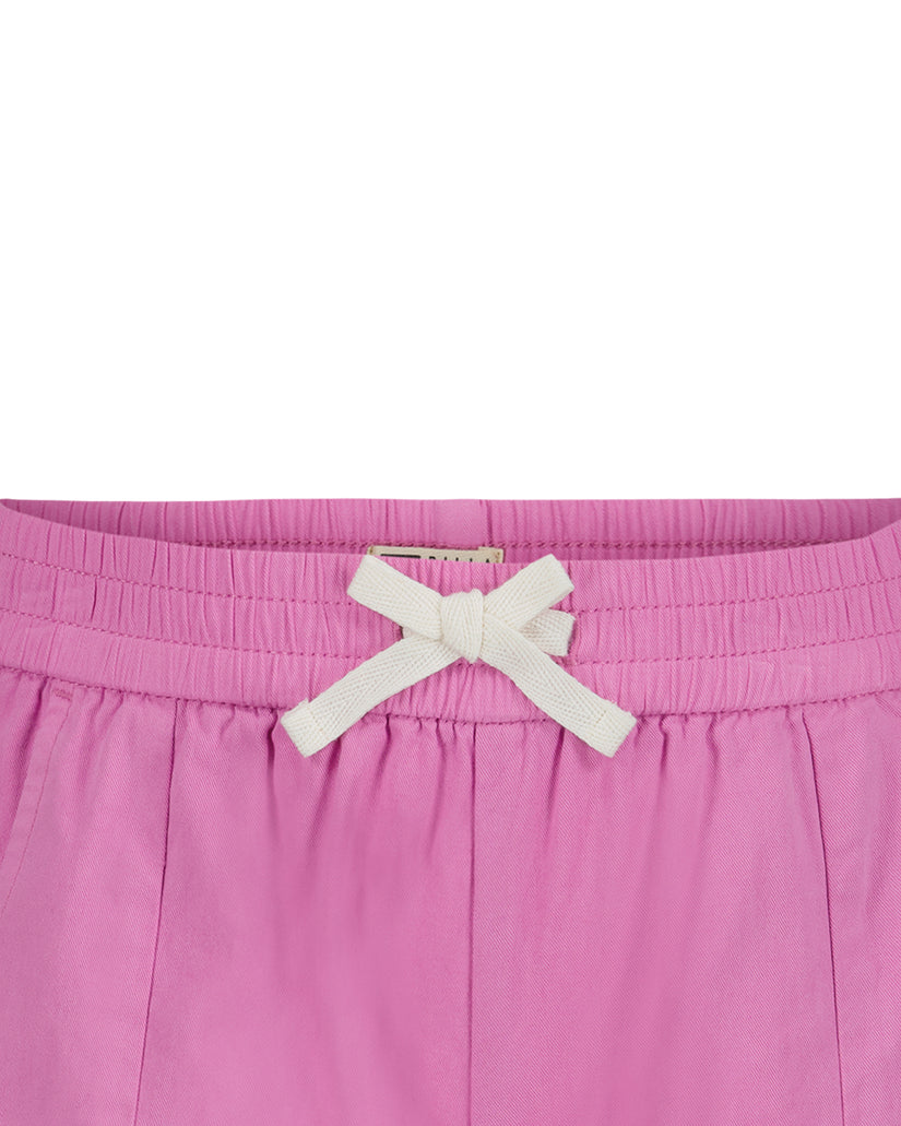 Pink shorts with white drawstring bow and ribbed waistband.