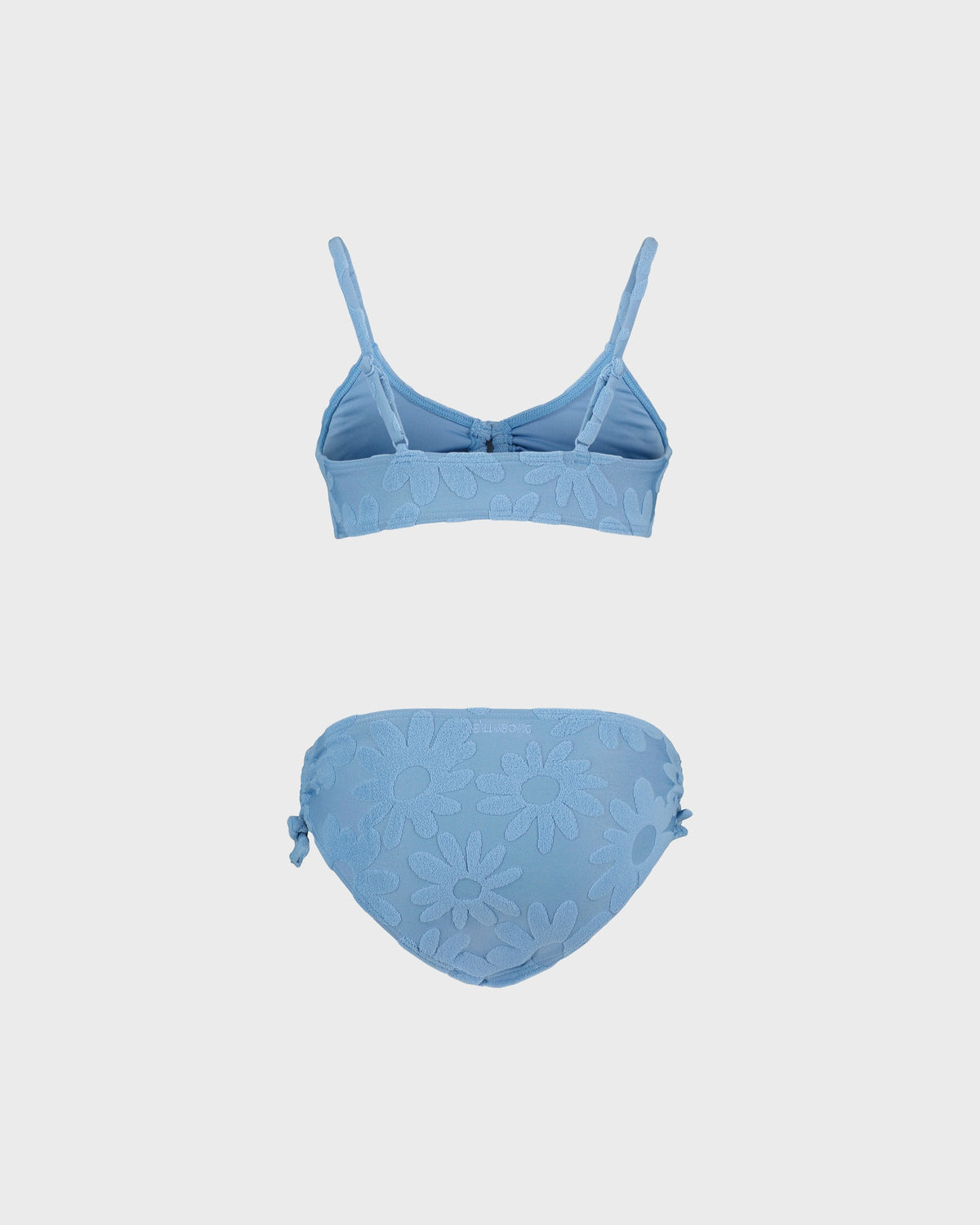 Blue bikini set on a light gray background