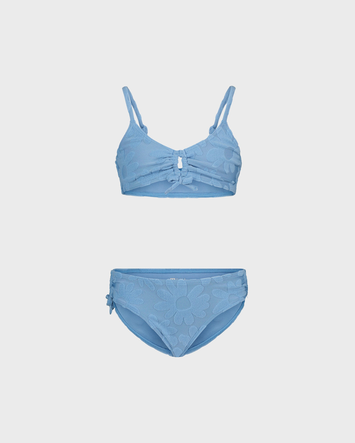 Blue bikini set on a light gray background