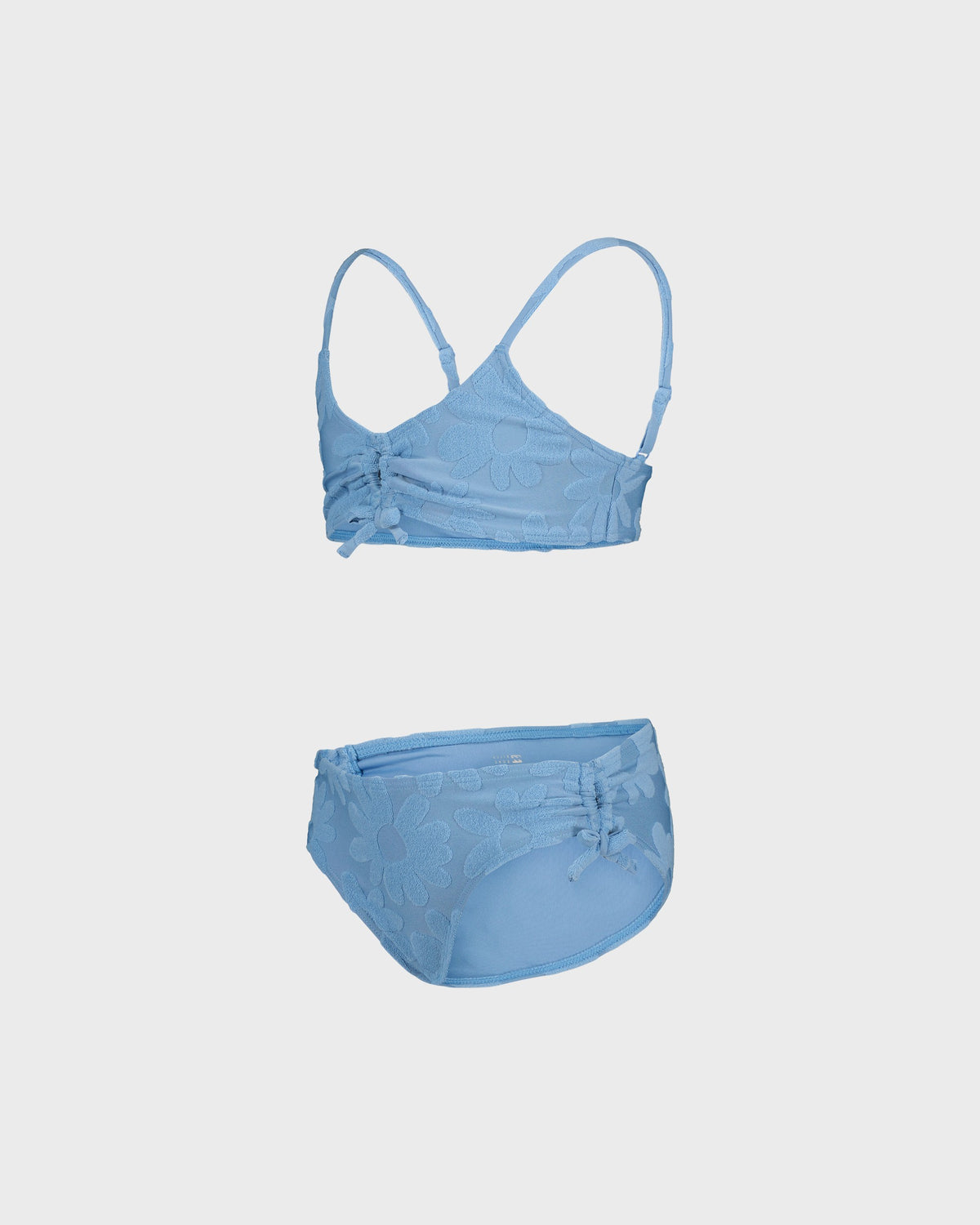 Blue bikini set on a light gray background