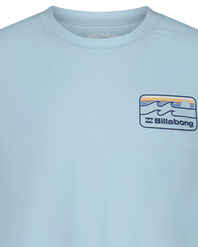 Light blue long sleeve surfshirt with Billabong wave logo patch on chest.