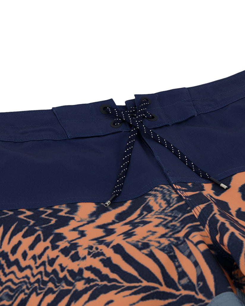 Navy and orange boardshorts with drawstring waistband and abstract pattern on lower leg.