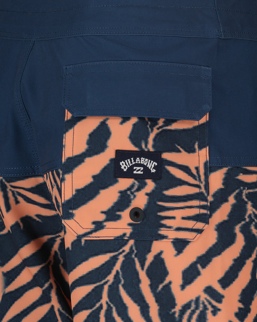 Navy boardshorts with orange and black zebra stripe panel and back pocket detail.
