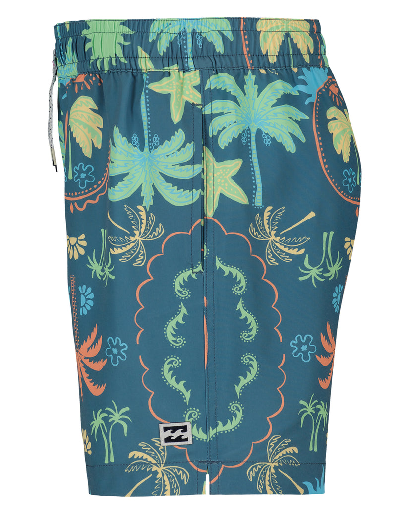 Boys swim trunks with teal background featuring tropical palm trees, flowers, and ornamental patterns in green, yellow, and o