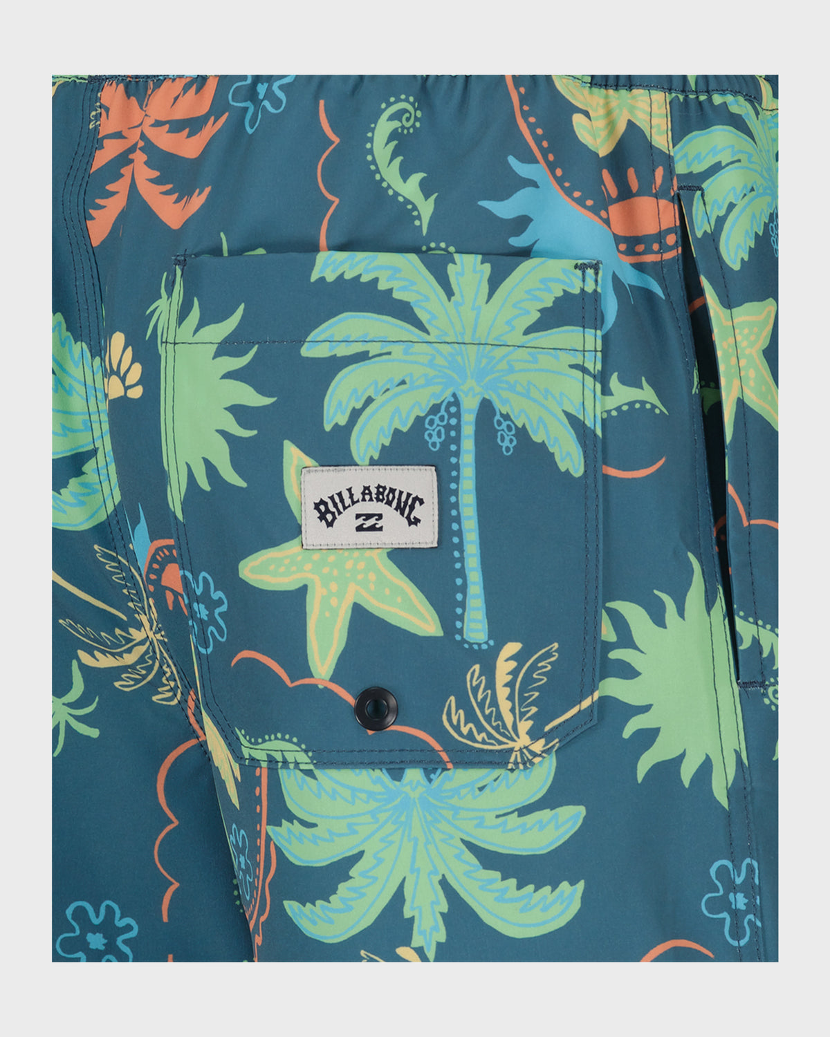 Teal swim trunks with lime green and orange tropical floral print, patch pocket with Billabong logo, and black button closure
