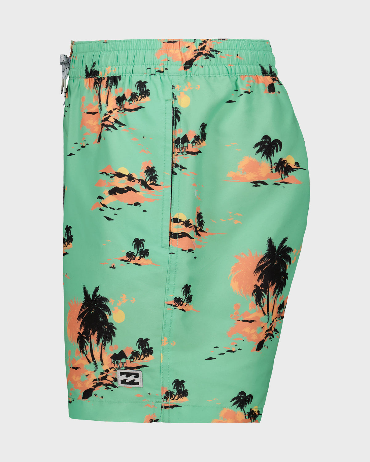 Mint green swim trunks with tropical palm tree and sunset print in orange, black, and yellow tones.