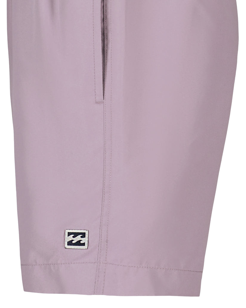 Lavender swim trunks with center seam and small logo patch on leg.