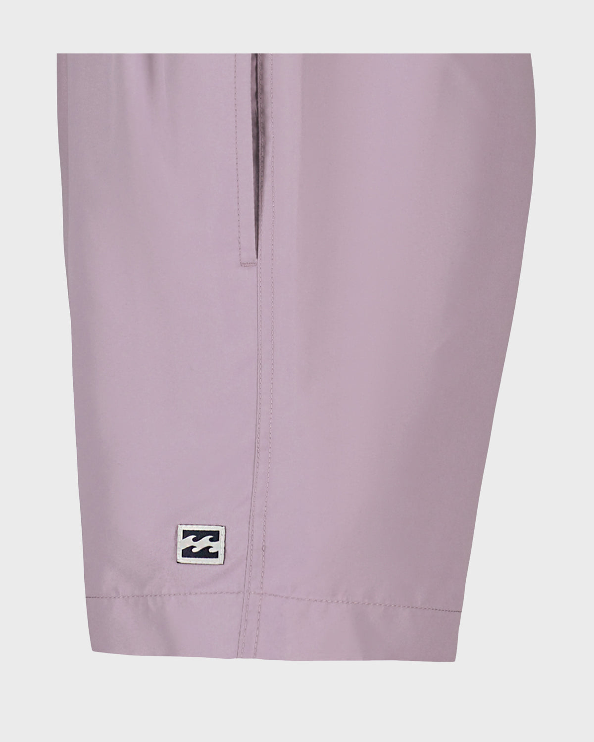 Lavender swim trunks with center seam and small logo patch on leg.