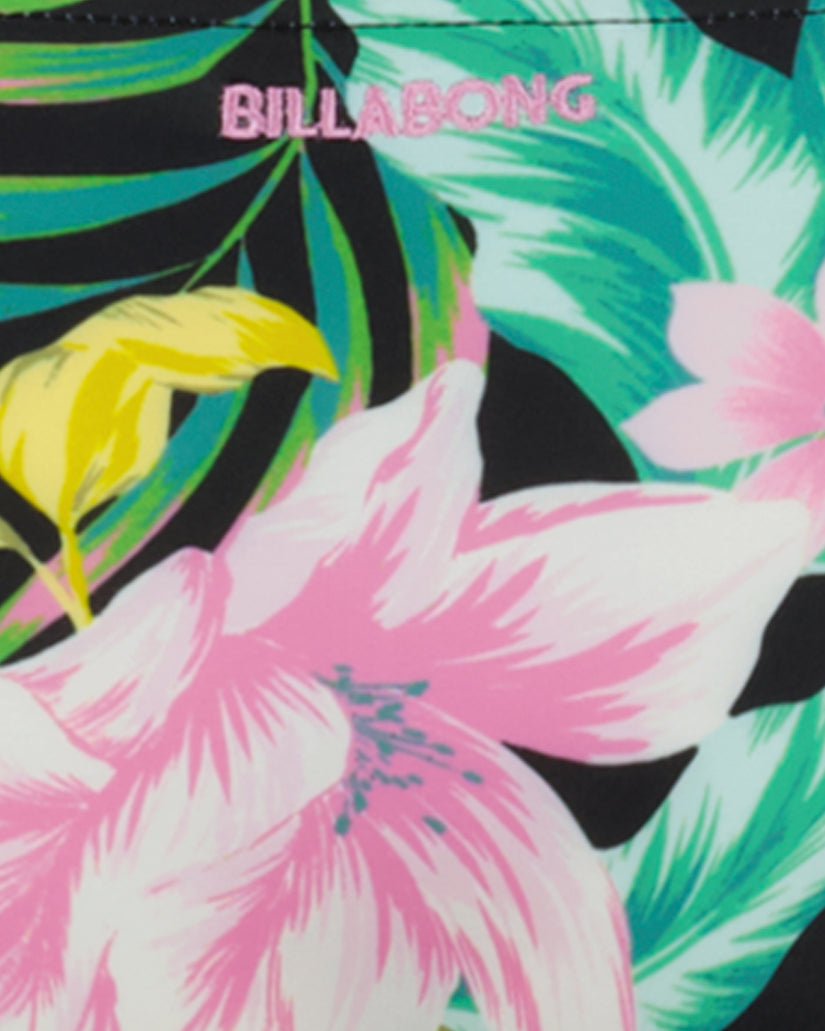 Tropical floral print bikini fabric with pink and white flowers, green leaves, and black background with Billabong branding.
