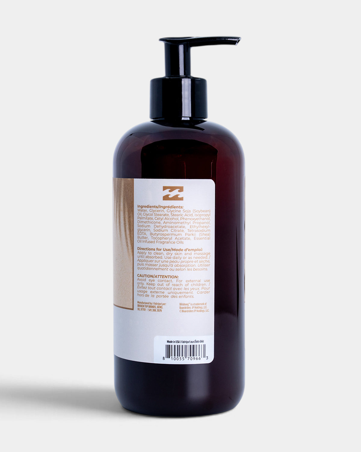 A dark amber plastic pump bottle with a black dispenser, showing the back label with text and a barcode, on a light gray background.