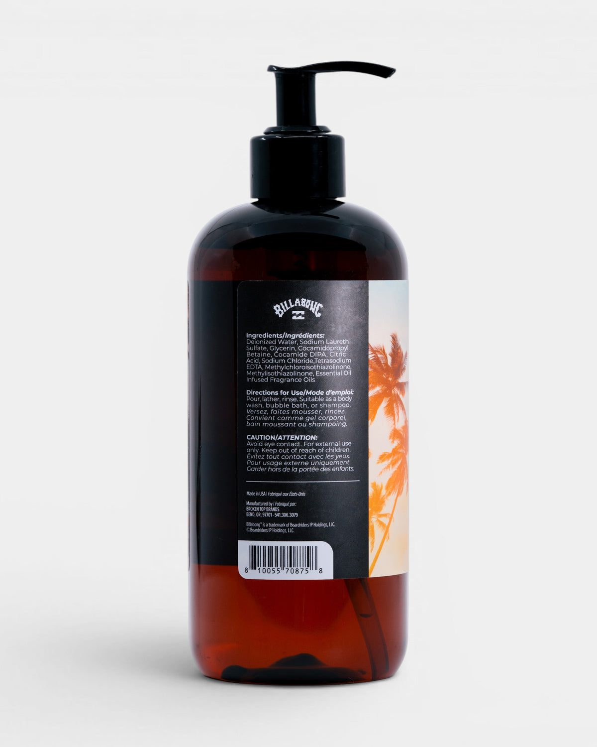 Dark amber pump bottle with black cap and label featuring orange palm tree graphic and ingredient list.
