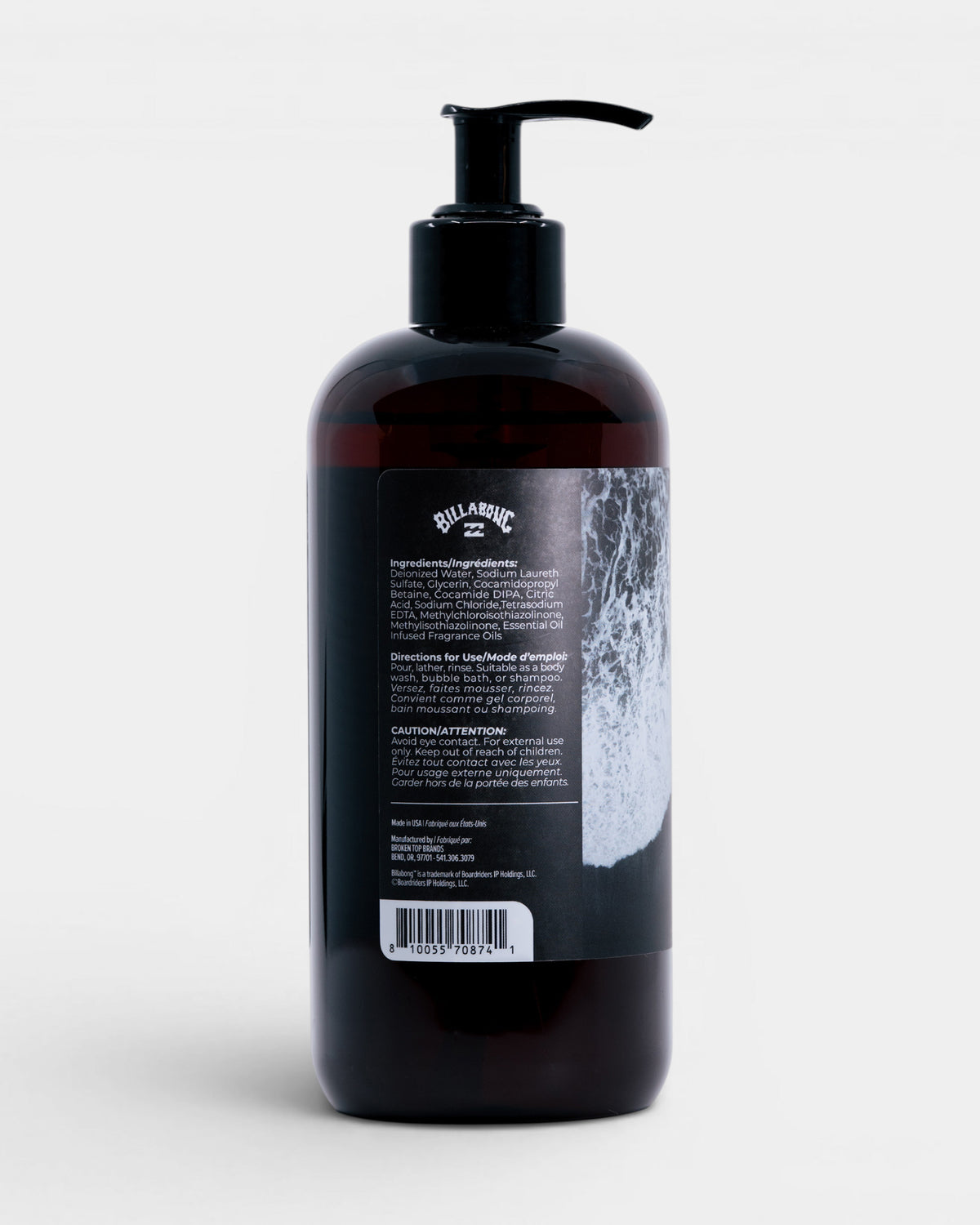 Black pump bottle containing dark liquid body wash with Billabong branding and product information label on back.