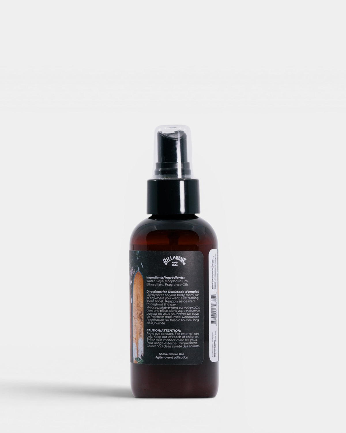 Dark amber spray bottle with black pump top and product label on gray background.