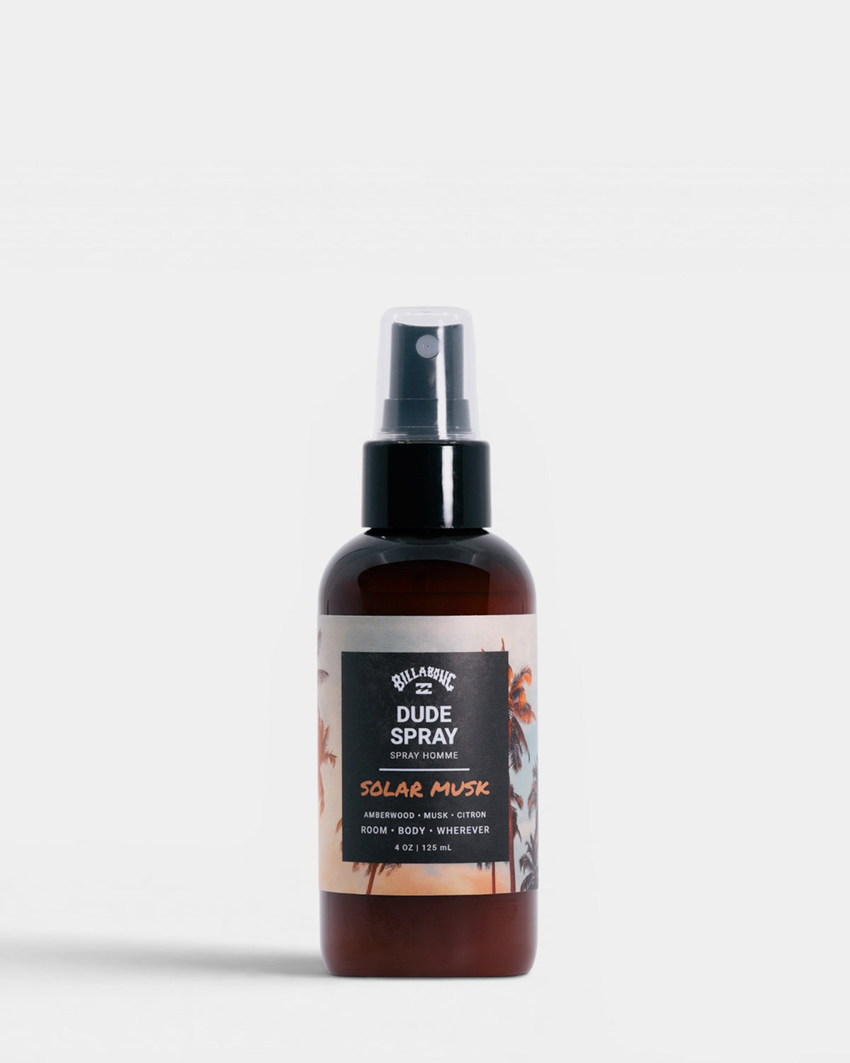 Dark amber glass spray bottle with black pump top and white label reading "Solar Musk Dude Spray" with palm tree design.