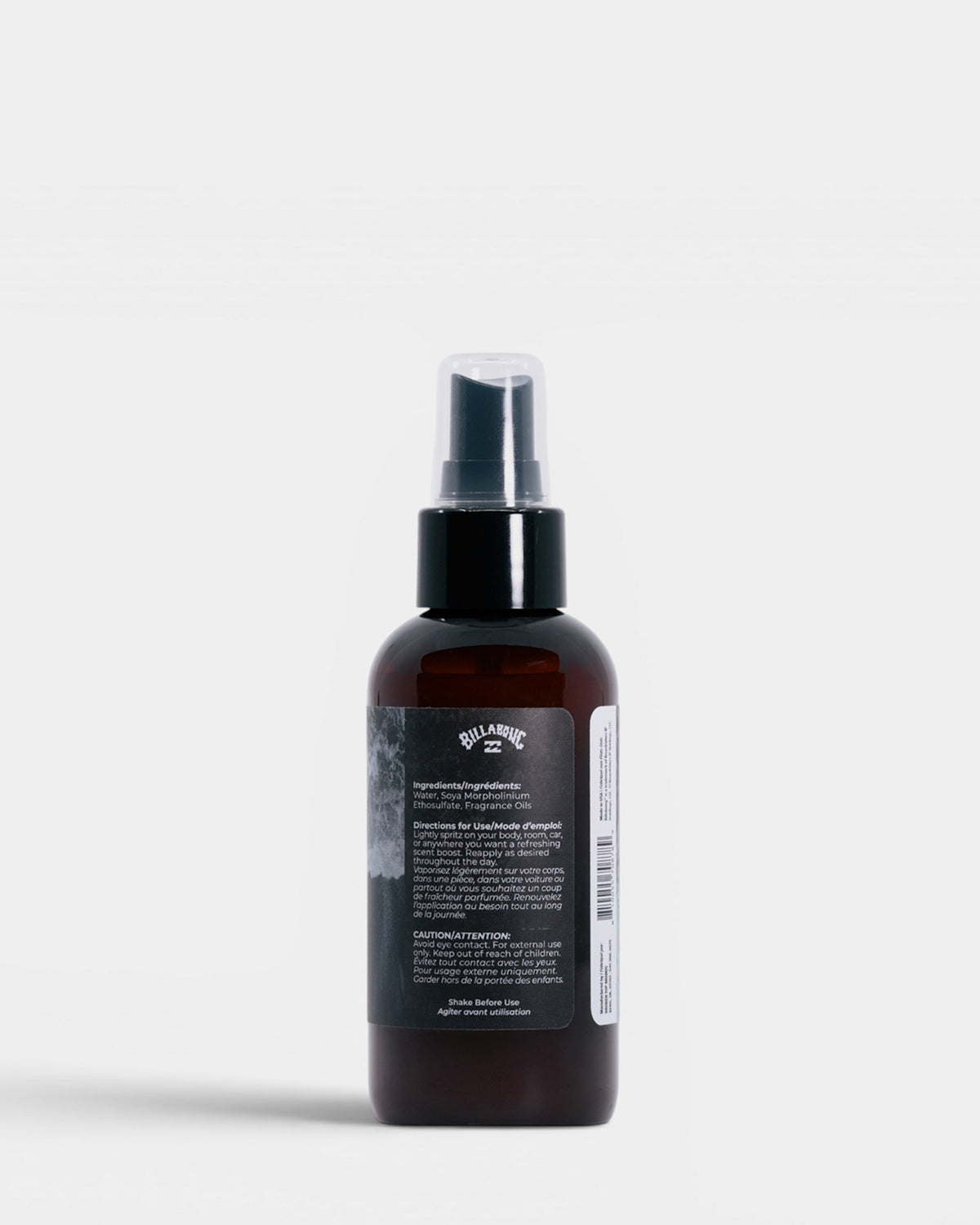 Dark amber glass spray bottle with black pump top and product label on white background.